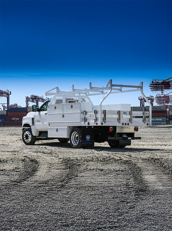 white upfitted truck at a work site